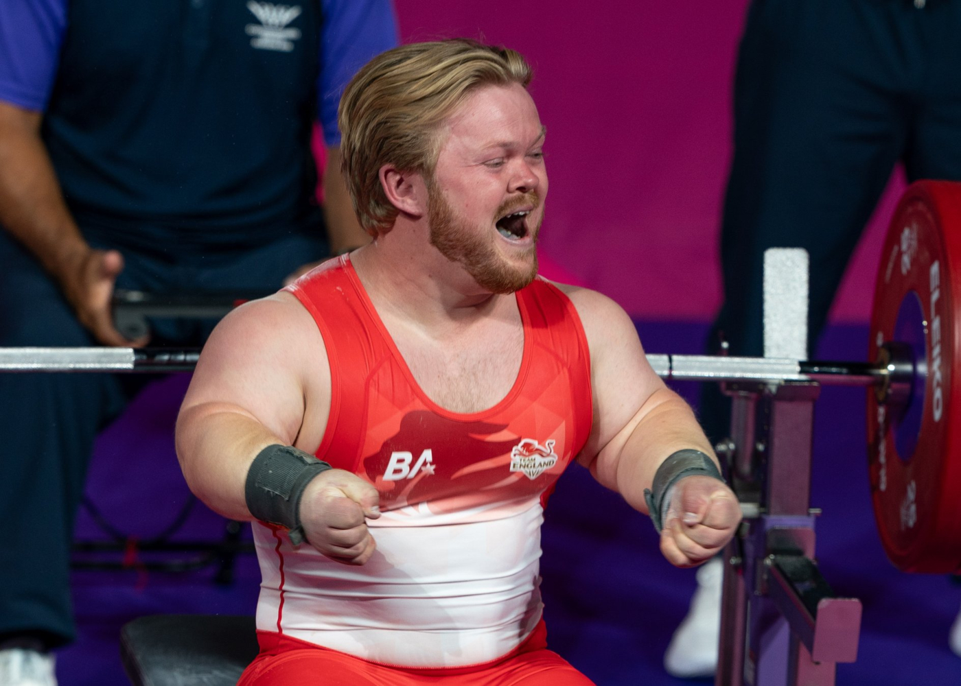Team England athletes celebrating on the track
